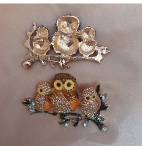 Front and back detail of crystal owl family brooch with rhinestones and enamel accents
