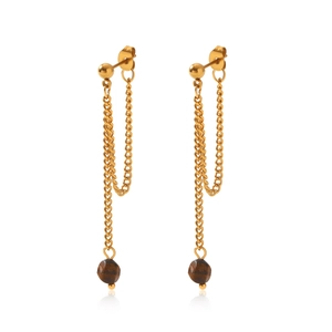 Macro detail of gold tassel earrings with tiger eye stone beads on a white background