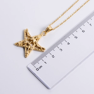 Gothic 18K gold pentagram skull pendant necklace shown with a ruler for size reference