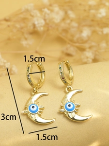 Detailed view of gold evil eye earrings with size dimensions 3cm length and 1.5cm width
