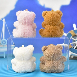 Back view of cute plush teddy bear pendants in four colors: pink, brown, white, tan.