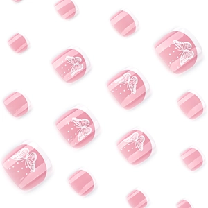 Pink French pedicure press-on nails with white butterfly patterns and polka dots
