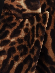 Macro shot of soft leopard print fabric texture for women's blazer and skirt suit
