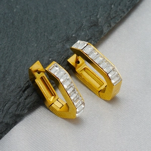Golden U-shaped hoop earrings with rectangular cubic zirconia and brushed metal texture