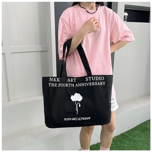 Large capacity black canvas tote bag with floral print and slogan for casual daily use