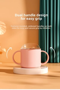 Pink baby sippy cup featuring ergonomic double handles for easy grip and stable base