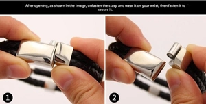 Detailed view of the black braided leather bracelet with silver magnetic metal clasp