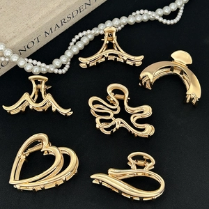 Set of 6 minimalist gold metal claw clips in heart and geometric shapes for thick hair