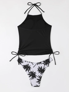 Detail view of black halter bikini top with side drawstrings and palm print bottoms