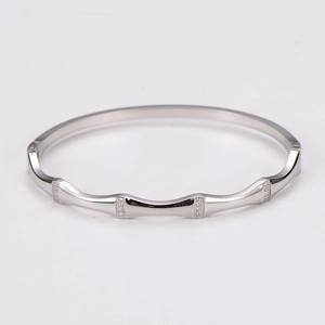Macro shot of silver bamboo design bracelet with shimmering pave-set small diamonds