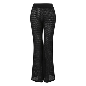 Detail of high waisted black crochet flare pants with sheer mesh texture and wide leg cut
