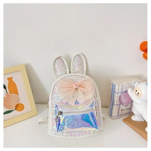 Detailed close-up of kids sequin backpack with bunny ears and a large pink bow decoration