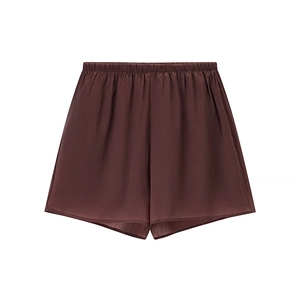 Detail of chocolate brown high-waisted elastic shorts with silk-like textured fabric