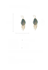Detailed view of emerald green leaf tassel earrings with rhinestone and size markings