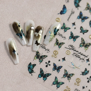 Steampunk butterfly nail stickers with gold gears and blue aurora foil accents