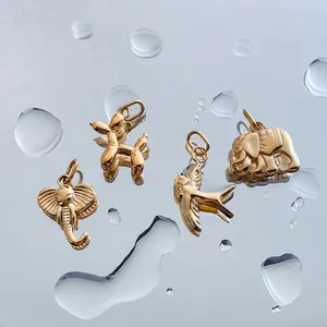 14K gold plated stainless steel charms set with bird and balloon dog motifs