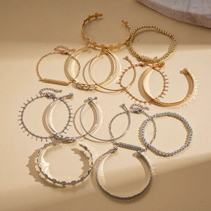 Elegant 7-piece set of geometric diamond-studded bracelets in gold and silver finish