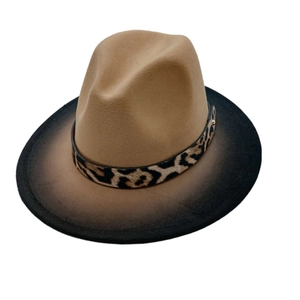 Close-up of gradient brown fedora hat with stylish leopard print leather band detail
