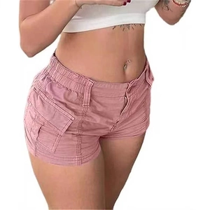 Detailed close-up of pink cargo denim shorts featuring large utility side pockets and cotton twill