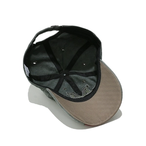 Internal detail of vintage baseball cap with reinforced stitching and metal buckle