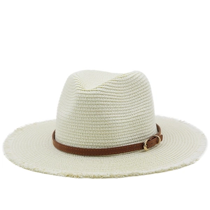 Detail of straw hat weave with brown leather band and frayed brim edge design