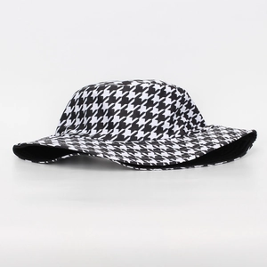 Detail of classic black and white houndstooth pattern on a modern bucket sun hat
