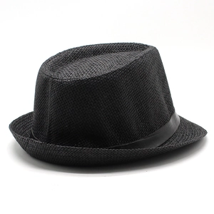 Close-up of black straw fedora hat featuring a detailed cross-weave texture and ribbon