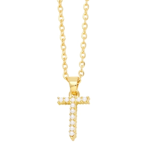Macro shot of gold-plated cross pendant featuring white inlaid pearls on a necklace