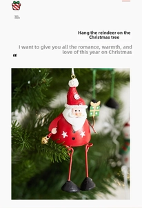 Detail of red Santa Claus metal hanging ornament with gold bell on green pine tree branches