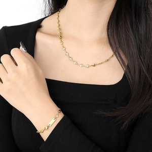 Golden heart-shaped chain necklace and bracelet set with an engravable rectangular plaque