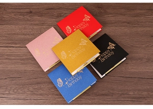 Detailed view of colorful 3D butterfly birthday cards with gold foil and glitter finish