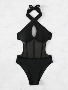 Detail view of black halter one-piece swimsuit with mesh panels and bow neckline