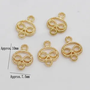 Detailed macro of golden alloy jewelry connectors with rope texture for DIY crafts