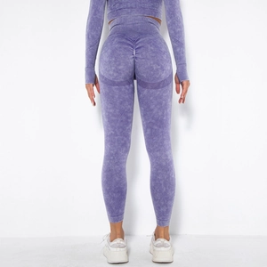 Macro detail of acid wash seamless leggings with scrunch butt lift texture on high waist yoga pants