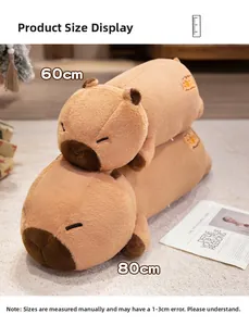 Detailed view of two soft capybara plush pillows in 60cm and 80cm sizes on a cozy rug