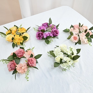 Five colored artificial rose and hydrangea candle rings for holiday table decoration