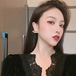 Elegant gold plated mesh round rhinestone stud earrings on female model in black lace