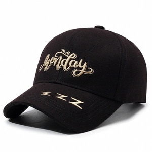 Black cotton baseball cap with gold Monday embroidery and side Z icons on white backdrop