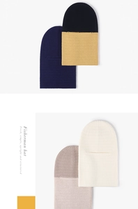 Close-up of ribbed knit texture on balaclava beanies in various solid and mixed colors