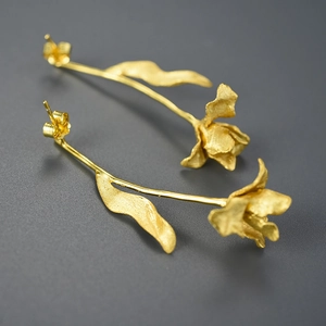 Elegant gold tulip S925 silver earrings with a matte texture on a dark grey background