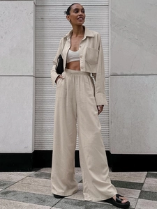 Women's casual two-piece beige linen set featuring long sleeve crop shirt and wide-leg pants