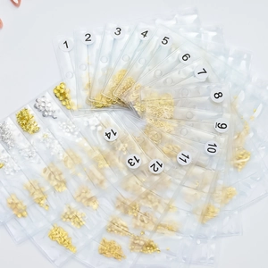 Set of 14 styles of gold and silver metallic nail art charms in shapes of stars and shells