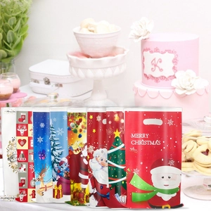 Detail view of assorted Christmas candy bags with Santa, reindeer and tree patterns