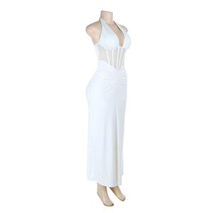 Detail of white halter gown featuring sheer mesh inserts and elegant waist pleats