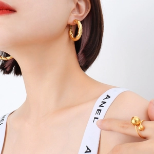 French style twisted hollow hoop earrings in 18k gold plated titanium steel for women