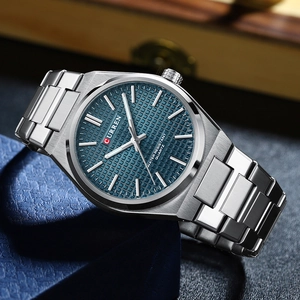 Detail view of Curren men's silver stainless steel watch with blue square textured dial