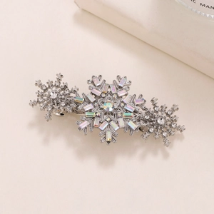 Elegant silver flower hair clip with sparkling rhinestones and snowflake design elements