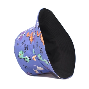 Detail of purple cotton bucket hat with cartoon dinosaurs and black inner lining