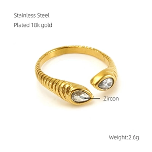 Detail of 18k gold plated stainless steel spiral ring with pear-cut zircon stones