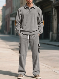 Detail of grey men's casual two-piece set showing corduroy texture and polo collar design